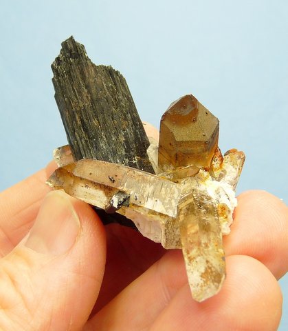 Group of quartz crystals with schorl crystals, feldspar and (?)goethite