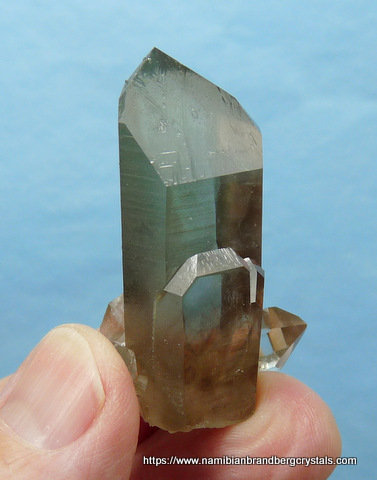 Phantom smoky quartz crystal with traces of chlorite in it