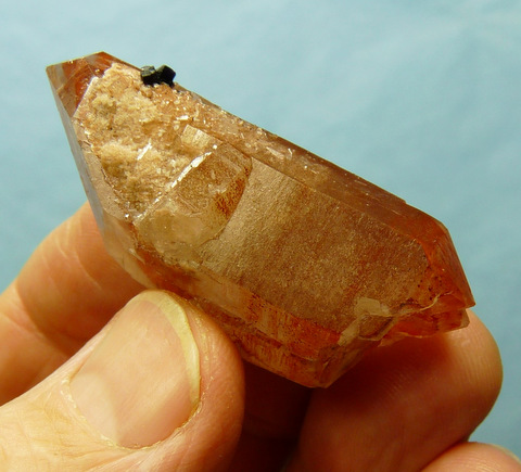Semi-transparent, double terminated quartz crystal with hematite and fluorite
