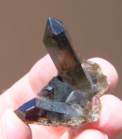A lovely smoky quartz crystal on matrix