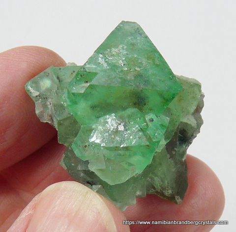 Green fluorite crystals with bits of purple