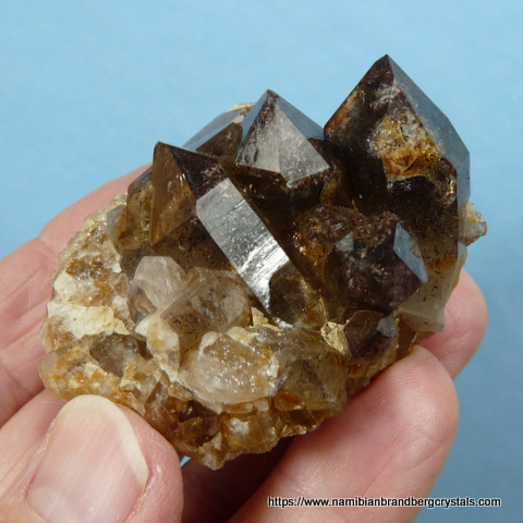Smoky quartz crystal group with inclusions