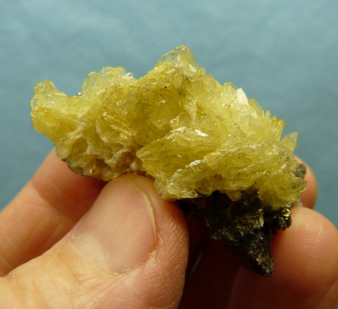 Light yellow, bladed barite crystals on matrix