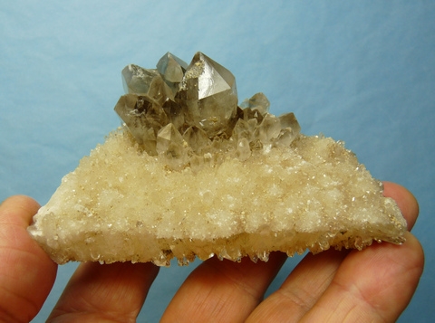 Light smoky quartz crystal s and very small quartz clusters on matrix