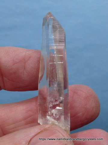 Gemmy quartz crystal with prominent growth marks