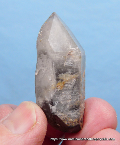 Phantom quartz crystal with dark smoky interior