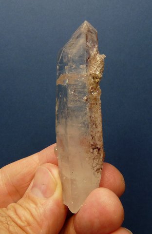 Quartz crystal with numerous tiny crystals on surface
