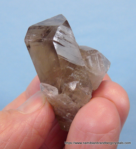 Quartz crystal group with smoky coloured zones