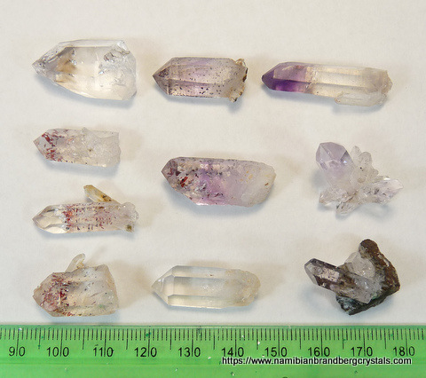10 small quartz crystals from Brandberg, including harlequin and amethyst
