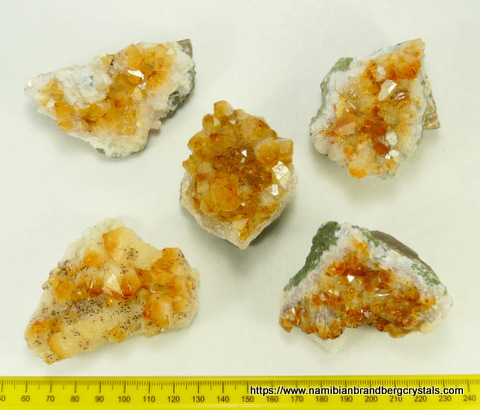 Five pieces of drusy 'citrine' coloured quartz crystals on matrix