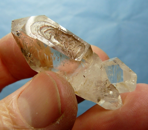 Double terminated quartz crystal with interesting growth patterns and touch of smoky colouring