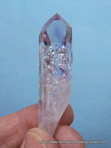 Gemmy, light amethyst quartz crystal with moving bubbles and negative crystals