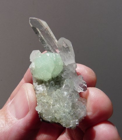Ball of bladed prehnite on quartz crystals, on basalt matrix
