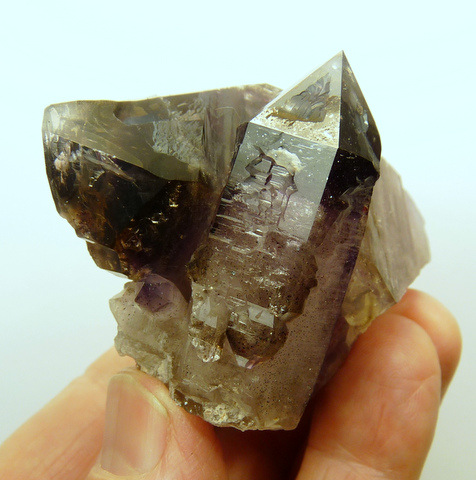 Quartz crystal group with smoky / amethyst colouring