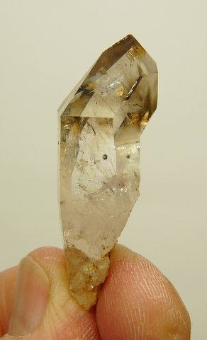 Semi-sceptre quartz crystal with light smoky colouring