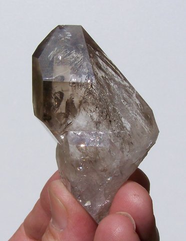 Quartz crystal with unusual shape and lovely gas inclusions