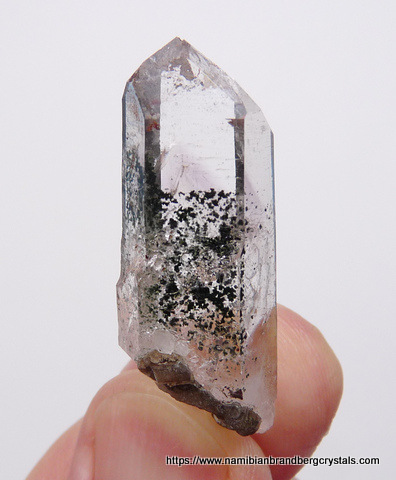 Quartz crystal with inclusions and bubbles