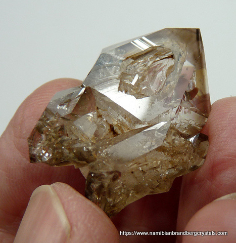 Smoky window quartz crystal with negative crystals inside
