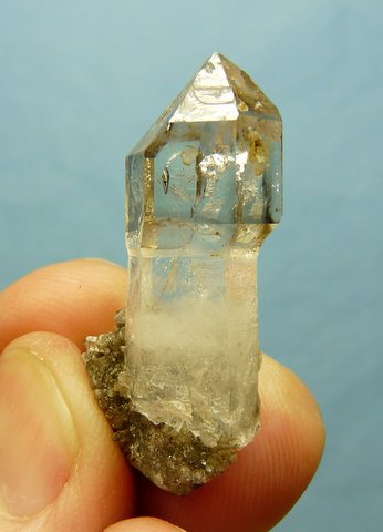 Small semi-sceptre quartz crystal on matrix