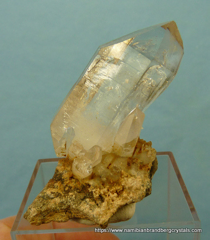 Double terminated quartz crystal on matrix