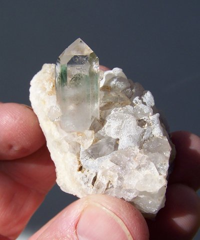 Clear quartz crystal with chlorite inclusion, on matrix