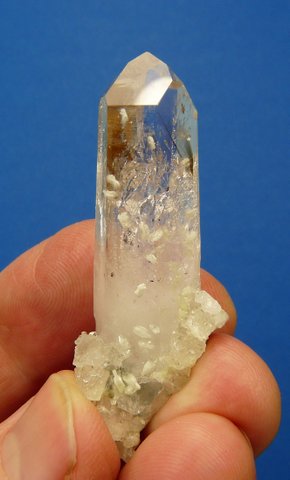 Quartz crystal with three other minerals, on matrix
