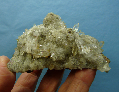 Clear quartz and calcite crystals on basalt matrix