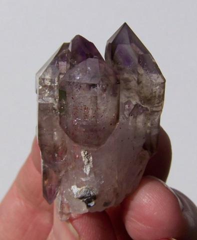 Amethyst / smoky quartz crystal group with interesting facets