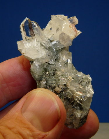 Quartz and calcite cluster on matrix, with traces of epidote