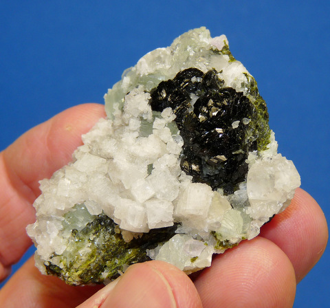 Epidote, calcite and prehnite crystals on matrix