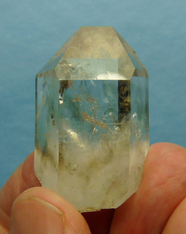 Quartz crystal with very faint smoky clouds and minute moving bubble