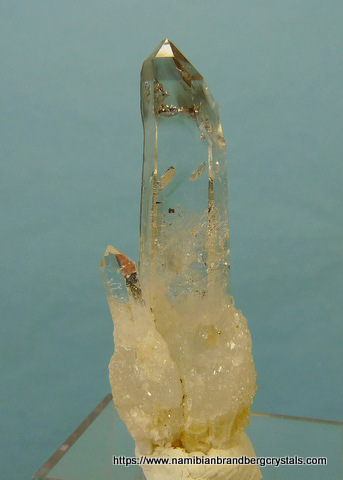 Quartz crystal with negative crystal inclusions
