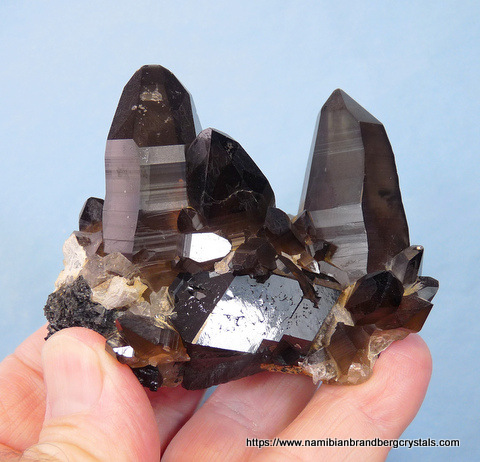 A group of smoky quartz and schorl crystals