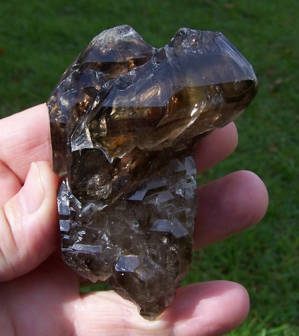 Large smoky window quartz crystal with goldenl-brown colour patches