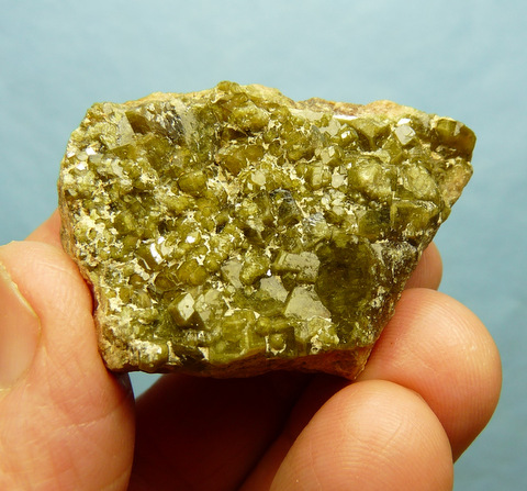 Demantoid garnets on feldspar matrix