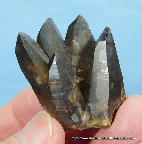 Smoky quartz crystal group with inclusions