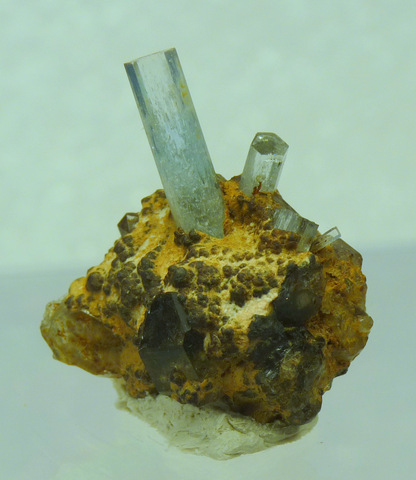 Small aquamarine crystals on quartz and goethite matrix