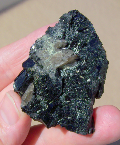 Schorl with numerous small, shiny facets, and smoky quartz
