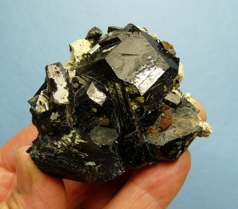 Schorl crystal cluster with bits of feldspar and a yellowish mineral