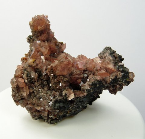 Brownish-pink smithsonite crystals on a chalcocite matrix