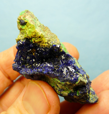 Small, exposed azurite geode, with azurite and malachite crystals on matrix