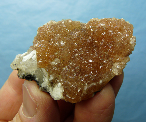 Drusy aggregates of camel coloured olmiite crystals on small matrix