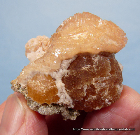 Two generations olmiite with bits of calcite between them