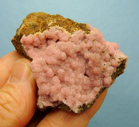 Tiny pink / lavender coloured rhodochrosite crystals on matrix