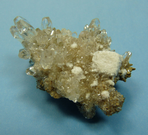 Glass clear, sparkling crystals of calcite and some oyelite on (?)manganite