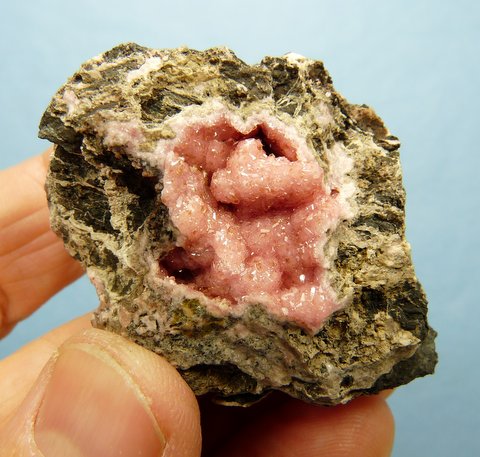 Geode with pink rhodochrosite crystals