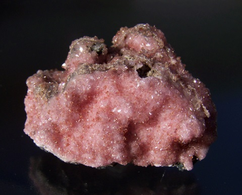 Sparkling orangy-red rhodochrosite crystals on drusy rhodochrosite, on matrix
