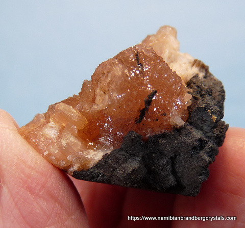 Olmiite crystals on rock matrix