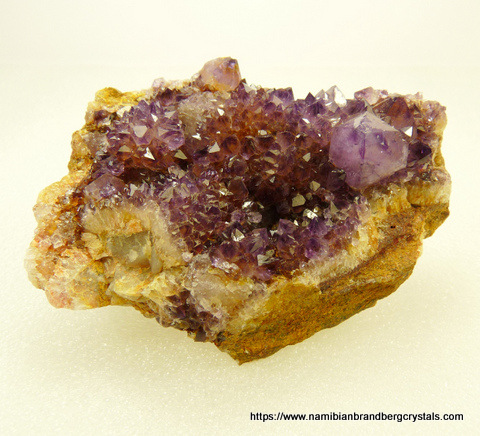 Drusy, small, light amethyst quartz crystals on matrix
