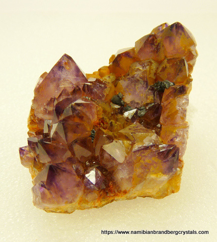 Group of amethyst quartz crystals on thin matrix